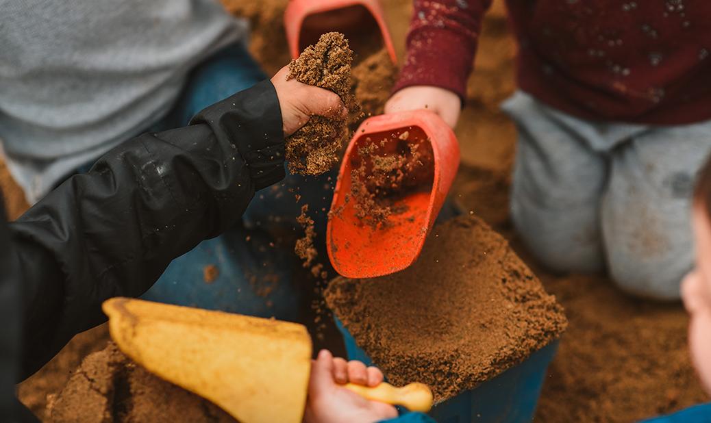 kids playing in a sandbox